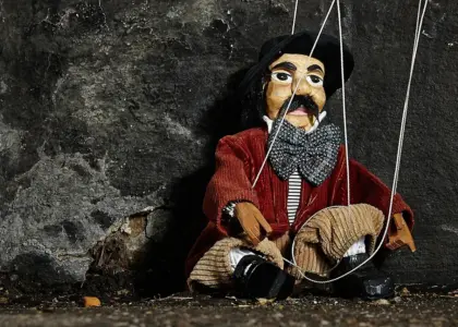 Hvem var Guignol, og hvorfor lever figuren videre i dag?